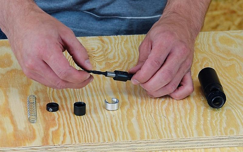 Step-by-step dowel joint production  - inserting the drill into the bushing