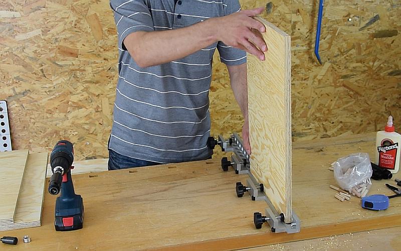 Step-by-step dowel joint production  - placing the workpiece into the jig
